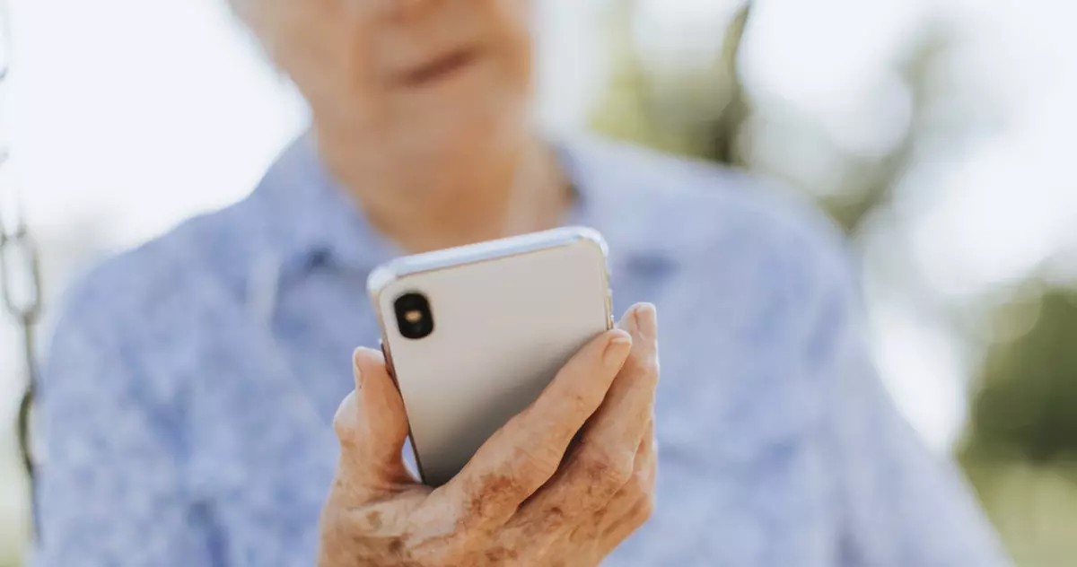 Old man using a mobile phone